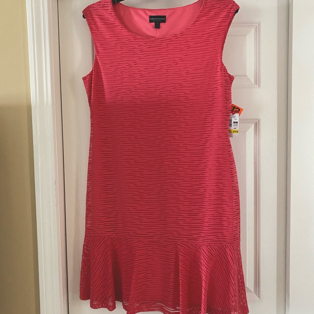 New by Connected Apparel sleeveless dress with ruffled bottom.